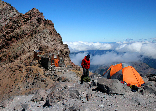 How can high altitude climbers survive with so little oxygen?