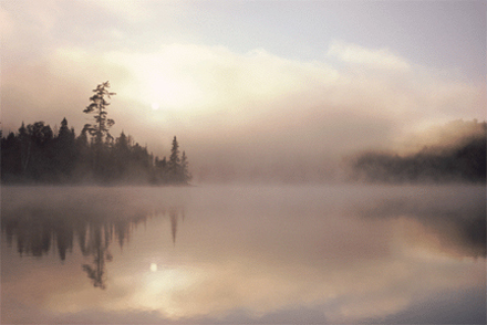 Cooling aerosol particles create a fog over a lake.  [CREDIT: RAP.UCAR.EDU]