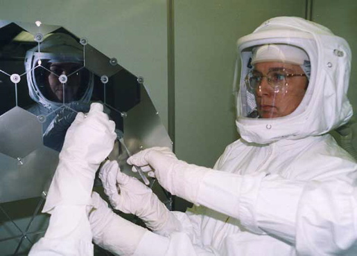 Dr. Eileen Stansbery assembles a delicate solar array in NASA's cleanest room in 2002. [CREDIT: NASA]