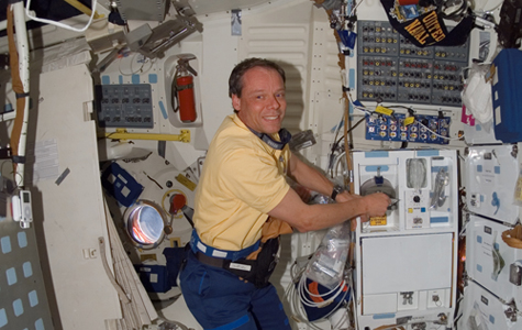 Can you spot the iPod in this image of astronaut Christer Fuglesang in the galley of Space Shuttle Discovery? [Credit: NASA]