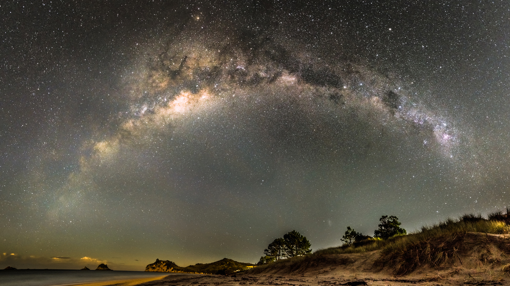 A panorama of the Milky Way over the Coromandel Peninsula in New Zealand.