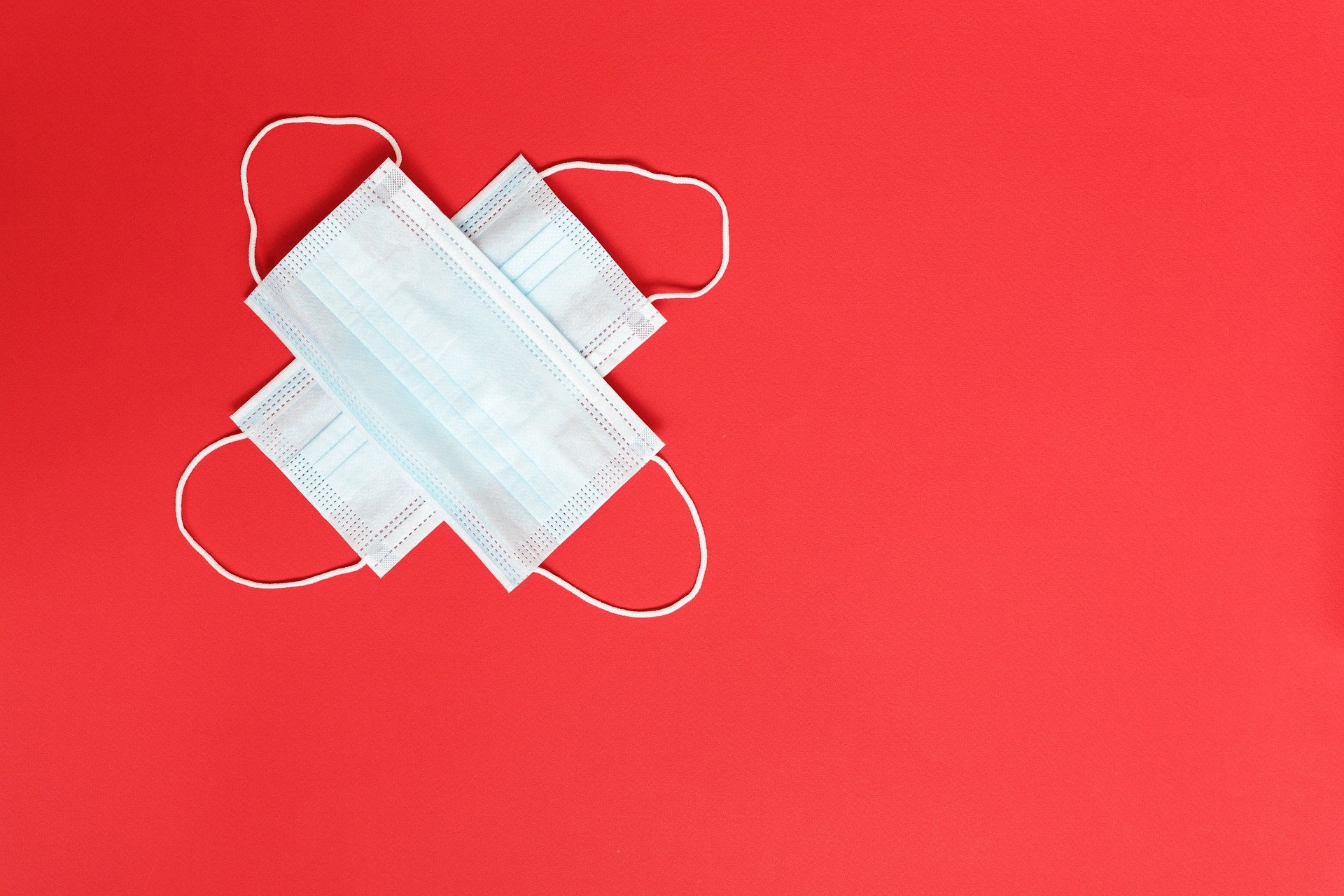 Two masks on a red background