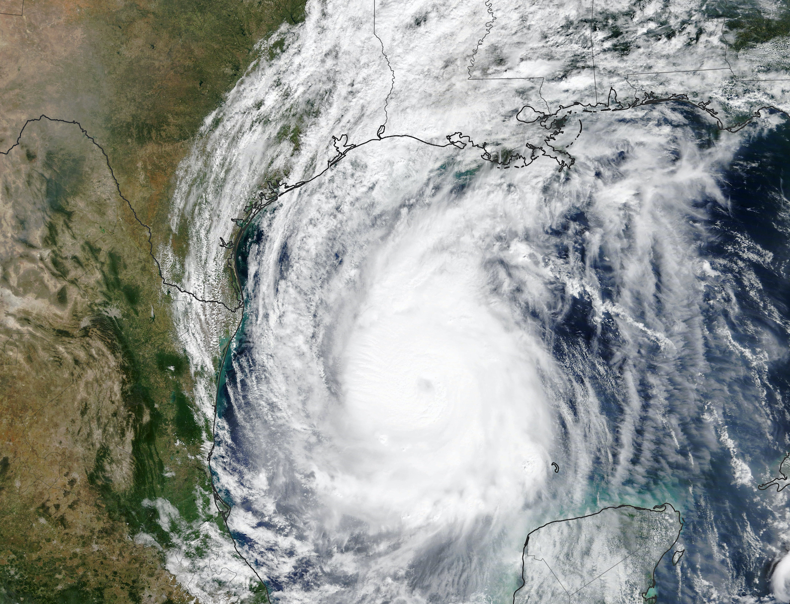 A color satellite image of Hurricane Delta swirling above the Gulf Coast