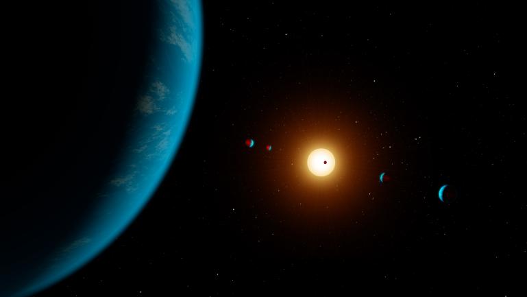 An artist’s interpretation of the K2-138 system, including 6 planets and 1 star.