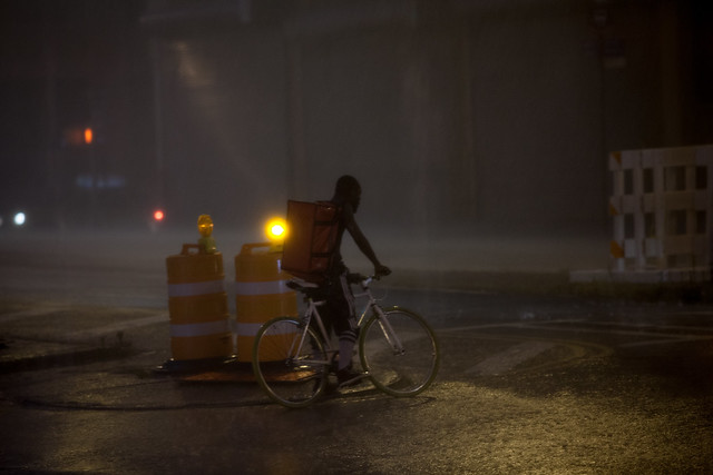 Rider biking through bad weather