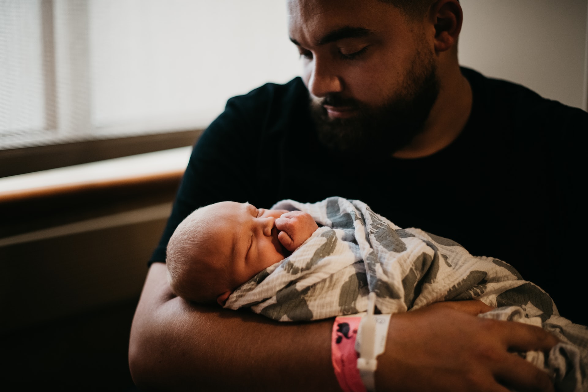 A father holding his newborn