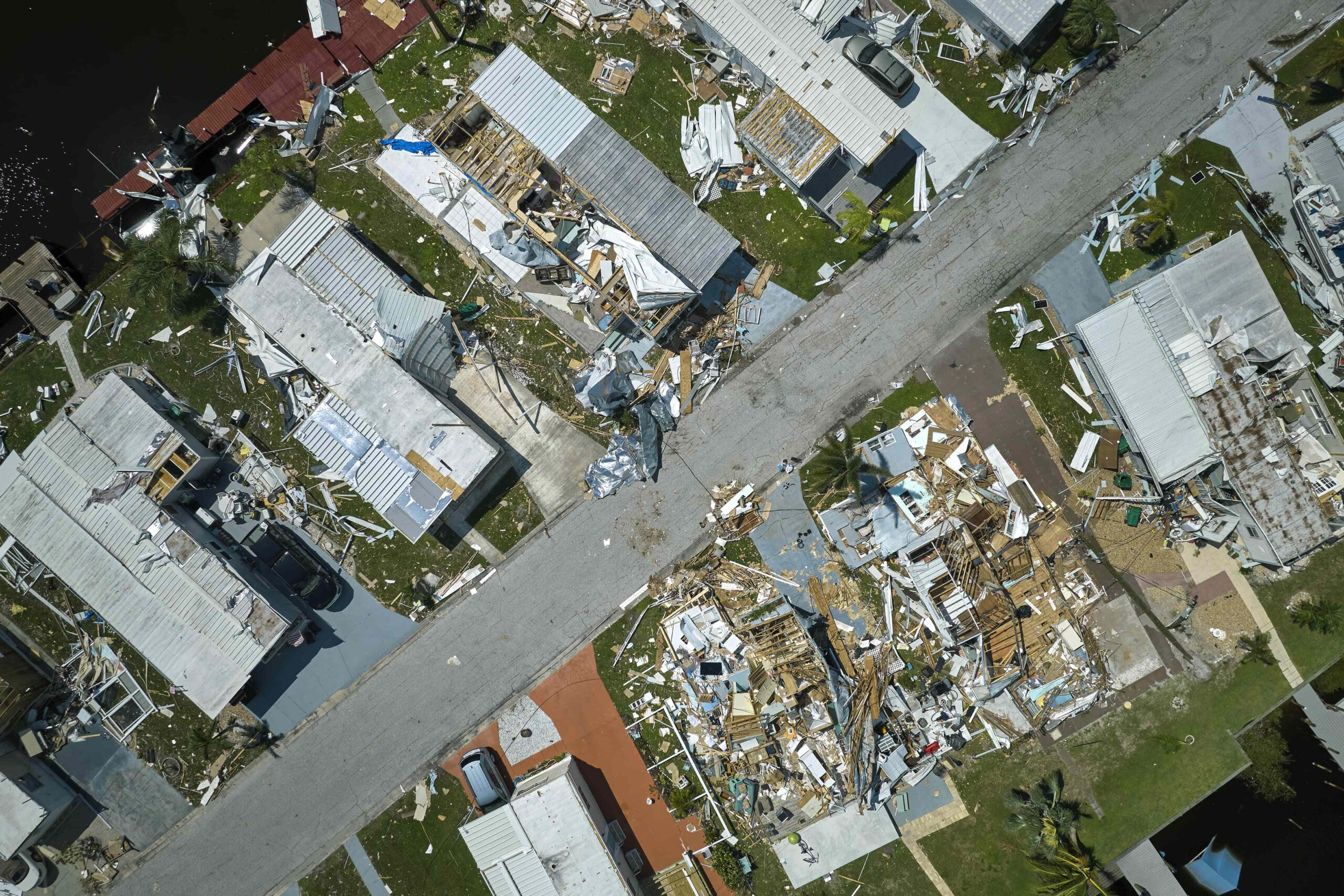 Damaged homes line a street in the wake of Hurricane Ian.