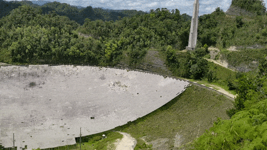 A short panoramic video of the remains of the Arecibo Telescope's massive dish, nestled into the green hills of northwest Puerto Rico