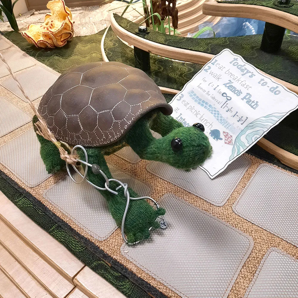A picture of Tess the Tortoise, a crochet tortoise with a ceramic shell