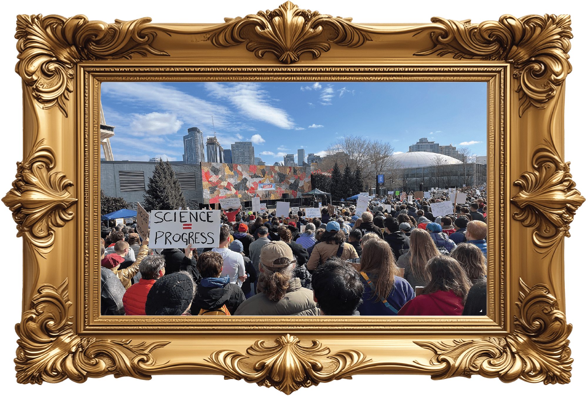 A crowd of pro-science protesters gather, holding up signs with sayings such as "science = progress."