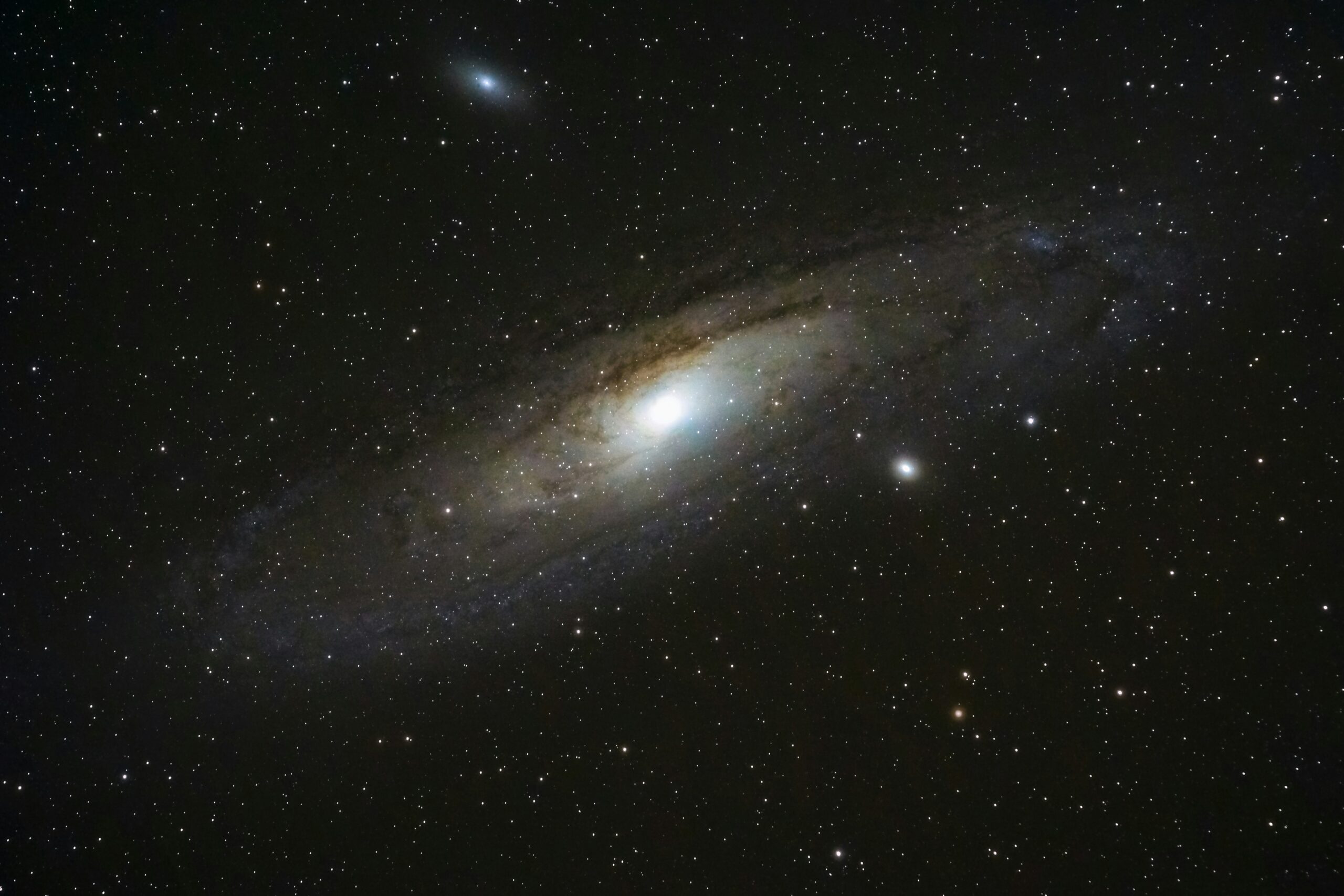 The spiral Andromeda galaxy shines against the darkness of space.